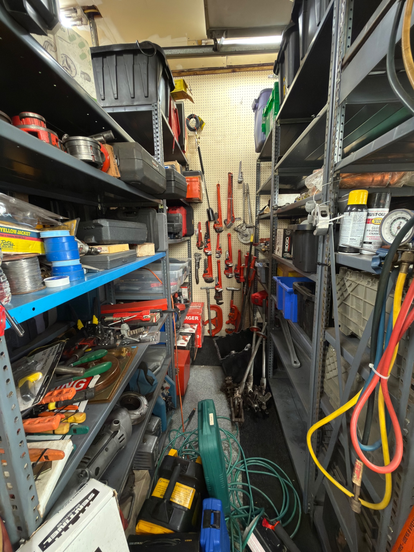 Aisle with pipe wrenches, HVAC gauges, and specialty tools