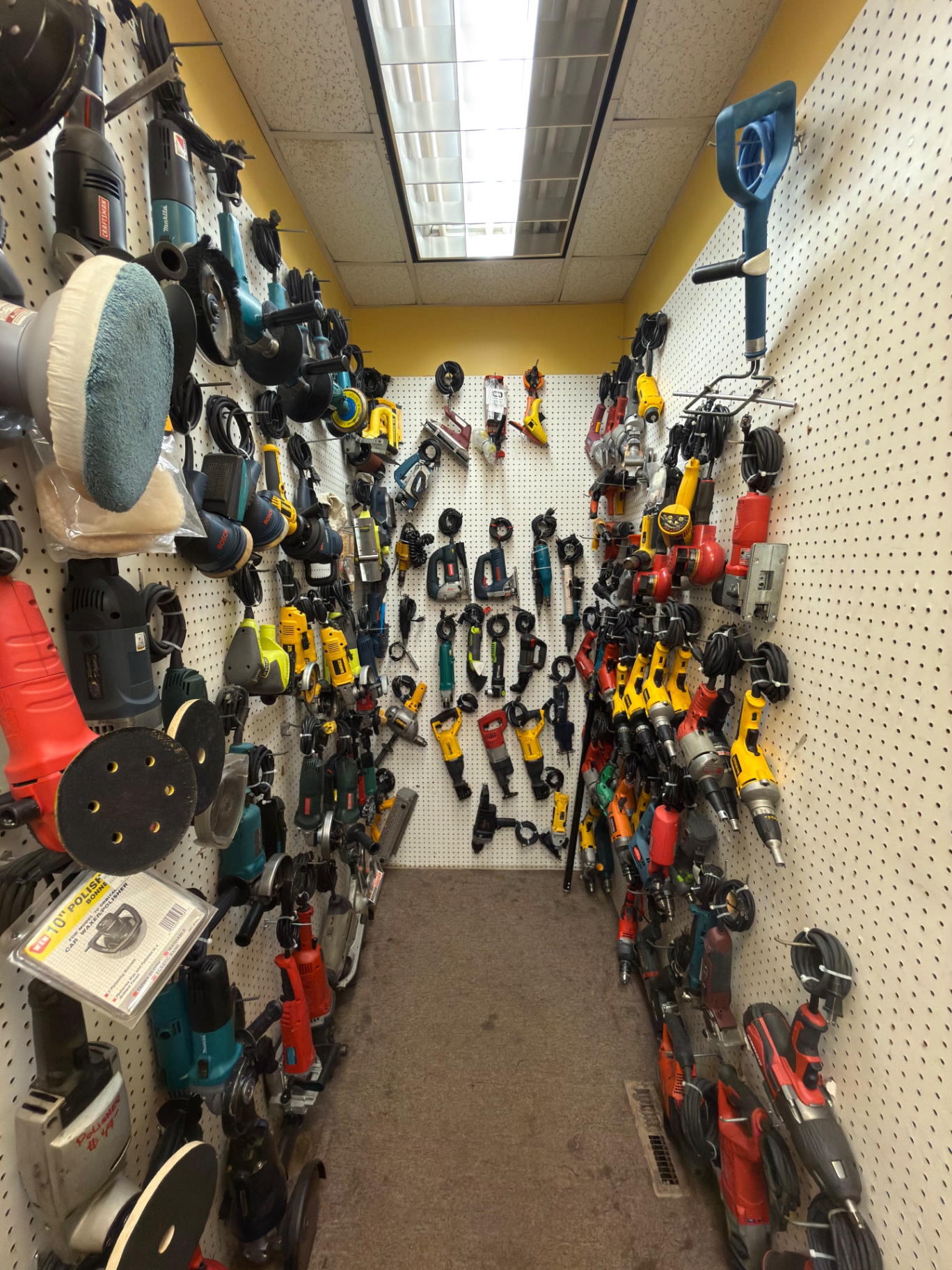 Wall of corded drills, sanders, and grinders