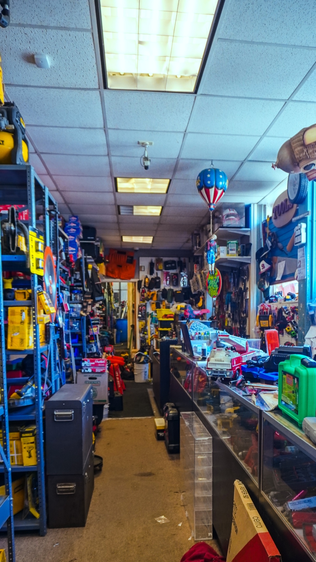 Interior of a well-stocked contractor's workshop with tools on pegboard walls