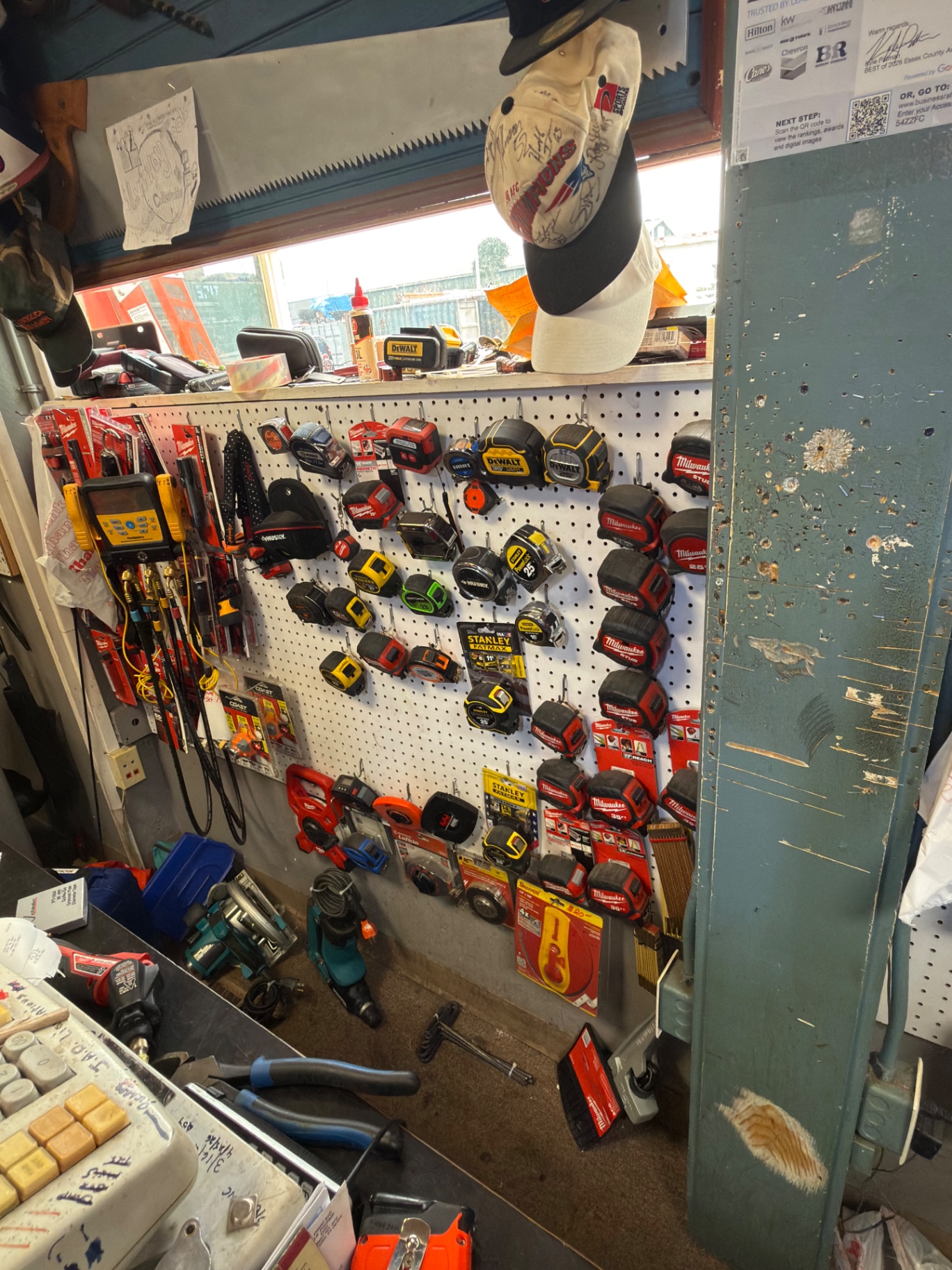 Pegboard of Milwaukee, DeWalt and Stanley tape measures